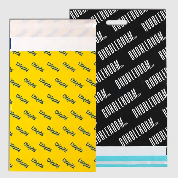 Yellow and black mailing bag with a printed pattern, closure flap and die-cut handle.