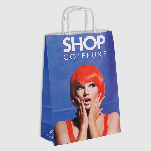 Paper bag with white twisted handles and a Shop Coiffure design